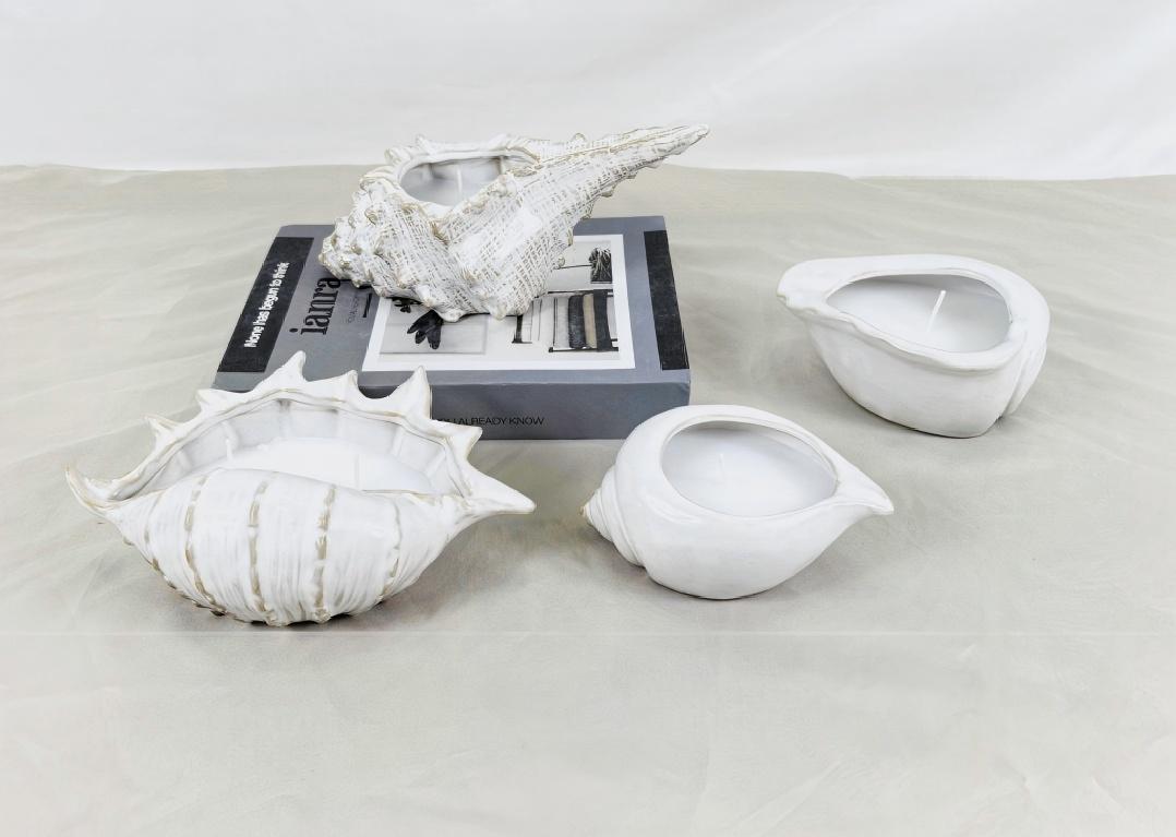 حاملات الشموع تأتي في أشكال عديدة. هل سبق لك أن رأيت واحدة على شكل صدفة؟